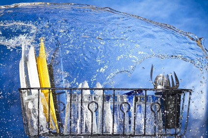 dishes in a running dish washer