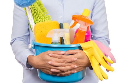 woman with cleaning supplies in a bucket