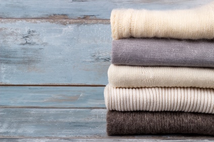 stack of wool sweaters