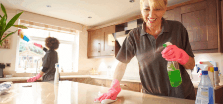Local house cleaners refreshing a kitchen environment.